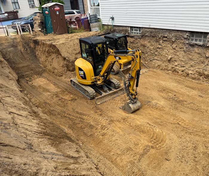Foundation being dug in Pittsburgh for a home addition